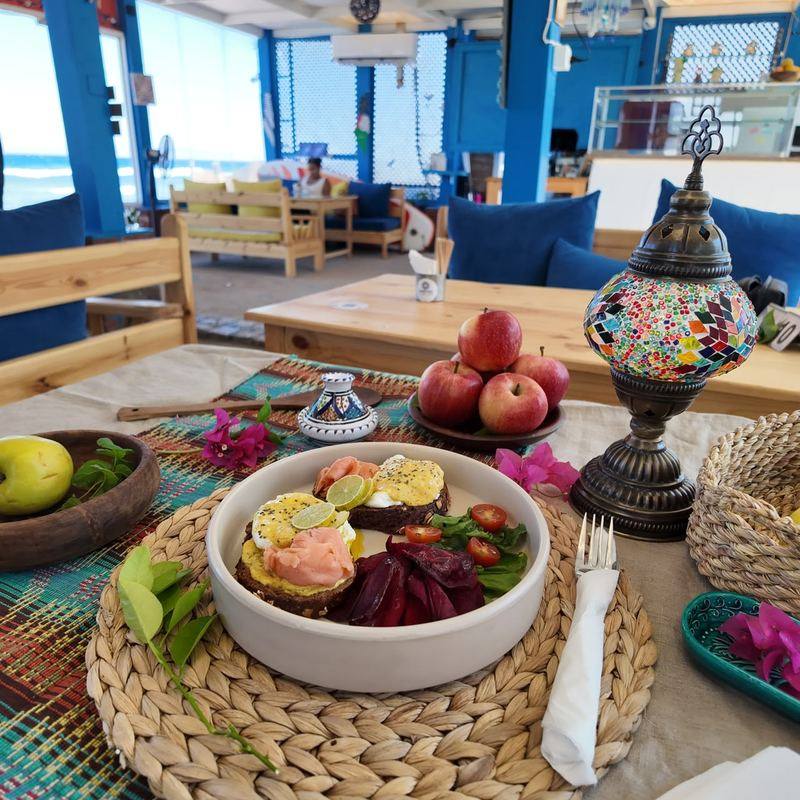Brunch on a table with the sea in the background